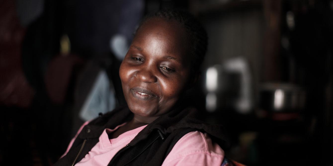 Grace Ondieke, a mother of 3, sits in her house in Mukuru informal settlement, in Nairobi, Kenya. Photo Credit: Sam Tarling Grace Ondieke, a mother of 3, sits in her house in Mukuru informal settlement, in Nairobi, Kenya. Photo Credit: Sam Tarling